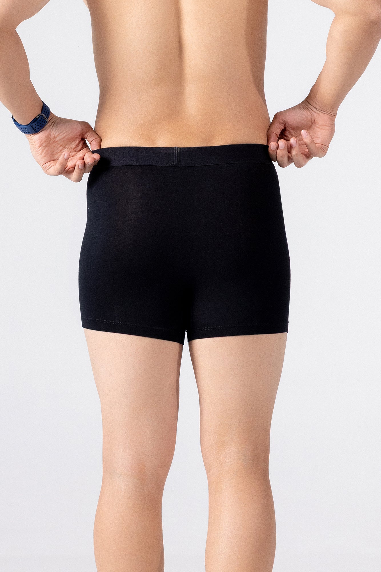Person is wearing black HIELABS Coolism Trunks for everyday comfort. 
