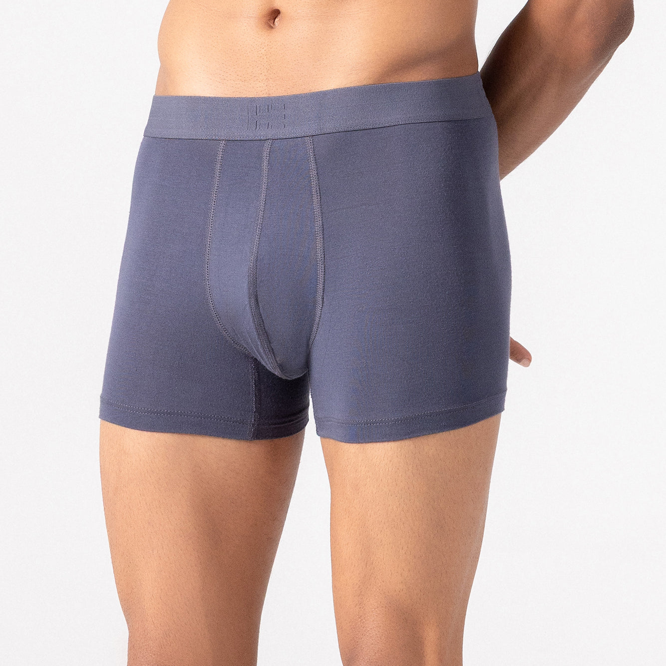 Person wearing grey HIELABS Coolism Trunks featuring a smooth fit and supportive elastic waistband.