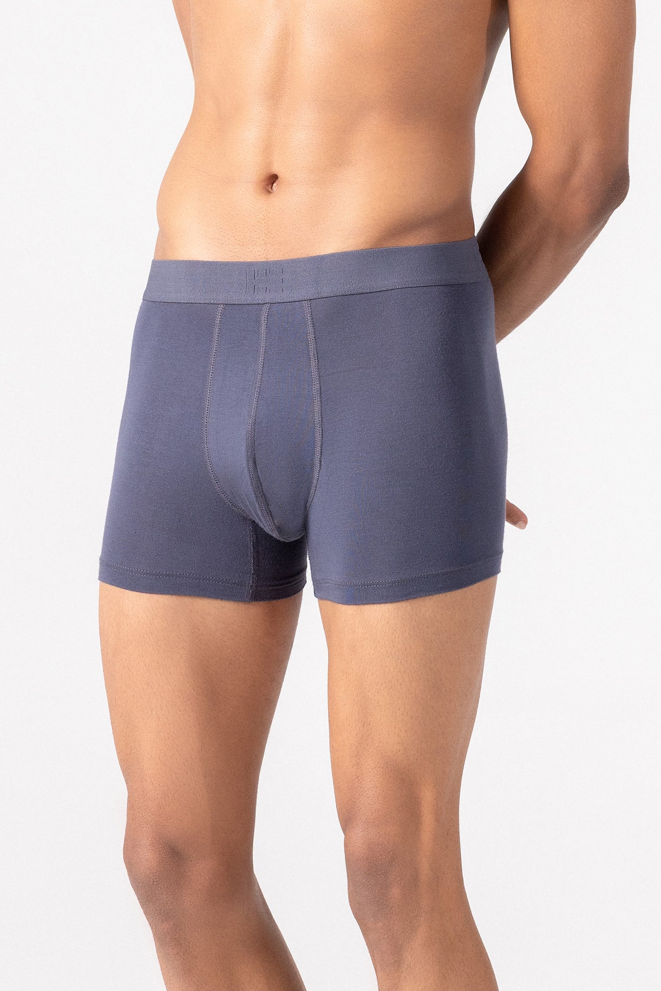 Person wearing grey HIELABS Coolism Trunks featuring a smooth fit and supportive elastic waistband.