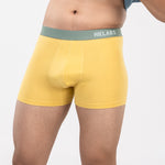 Person is wearing yellow HIELABS Coolism Trunks paired with a blue t-shirt for everyday comfort. 
