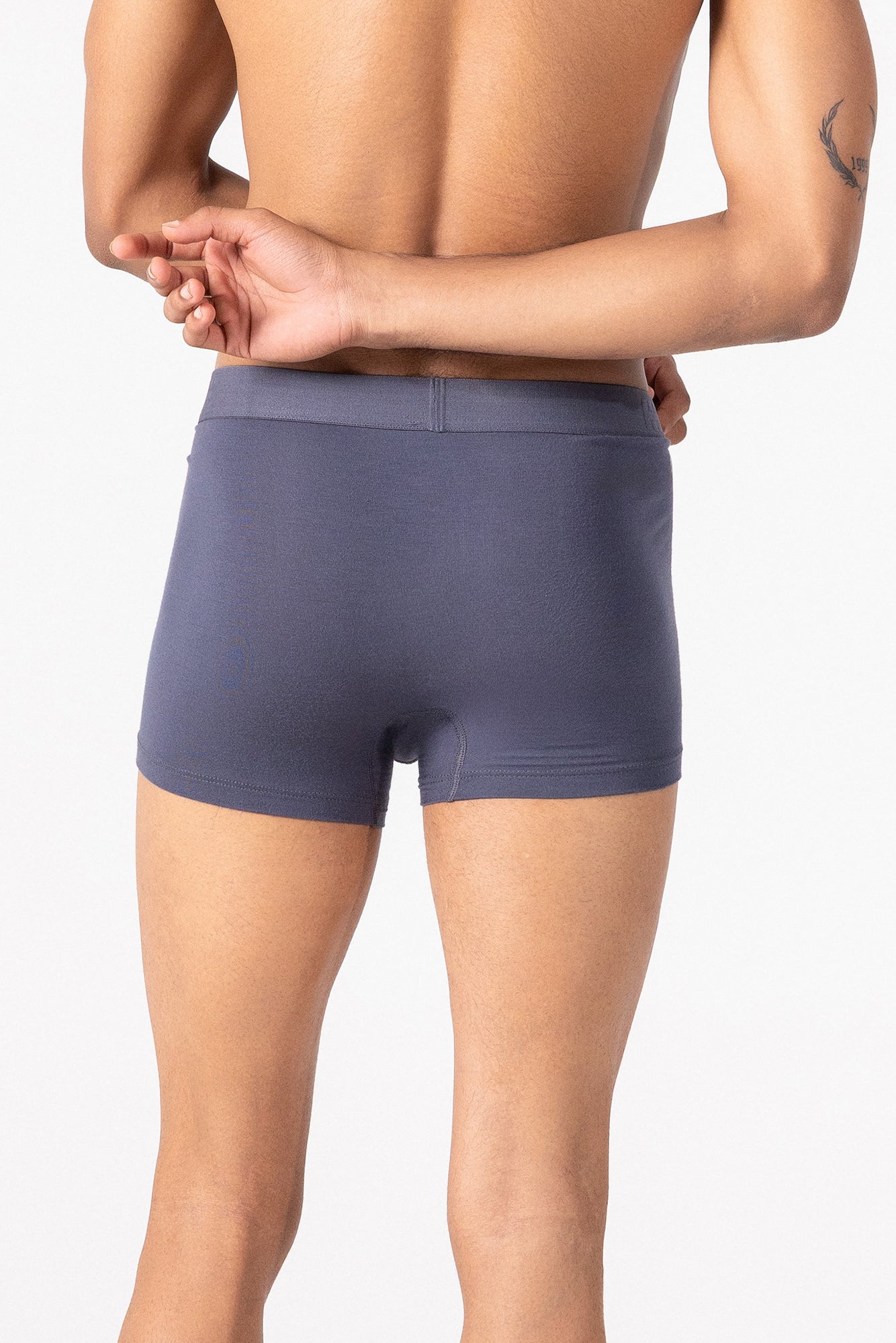 Person wearing grey HIELABS Coolism Trunks featuring a smooth fit and supportive elastic waistband.