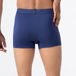 Person wearing a classic navy HIELABS Coolism Trunks with comfortable elastic waistband. 