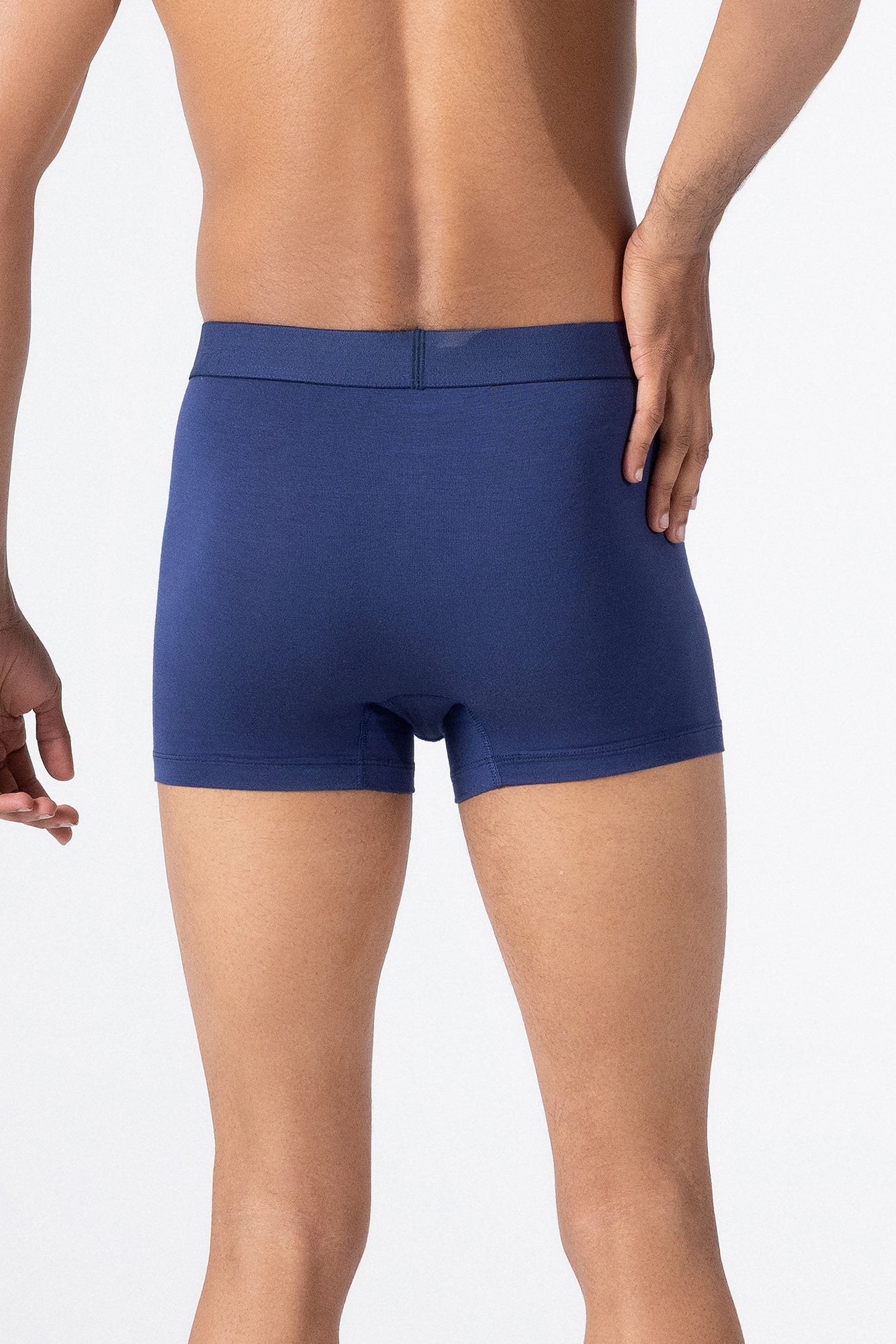 Person wearing a classic navy HIELABS Coolism Trunks with comfortable elastic waistband. 
